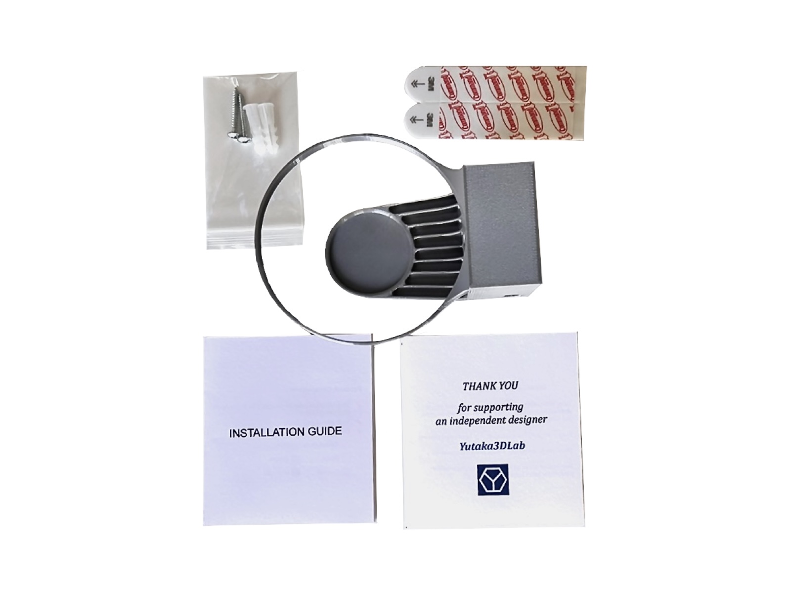 HomePod Mini wall mount package contents with hardware and printed materials